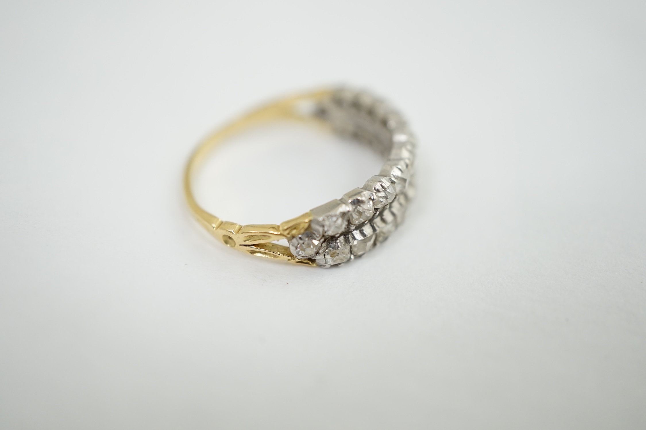 A late Victorian gold and two row old mine cut diamond cluster set half hoop ring